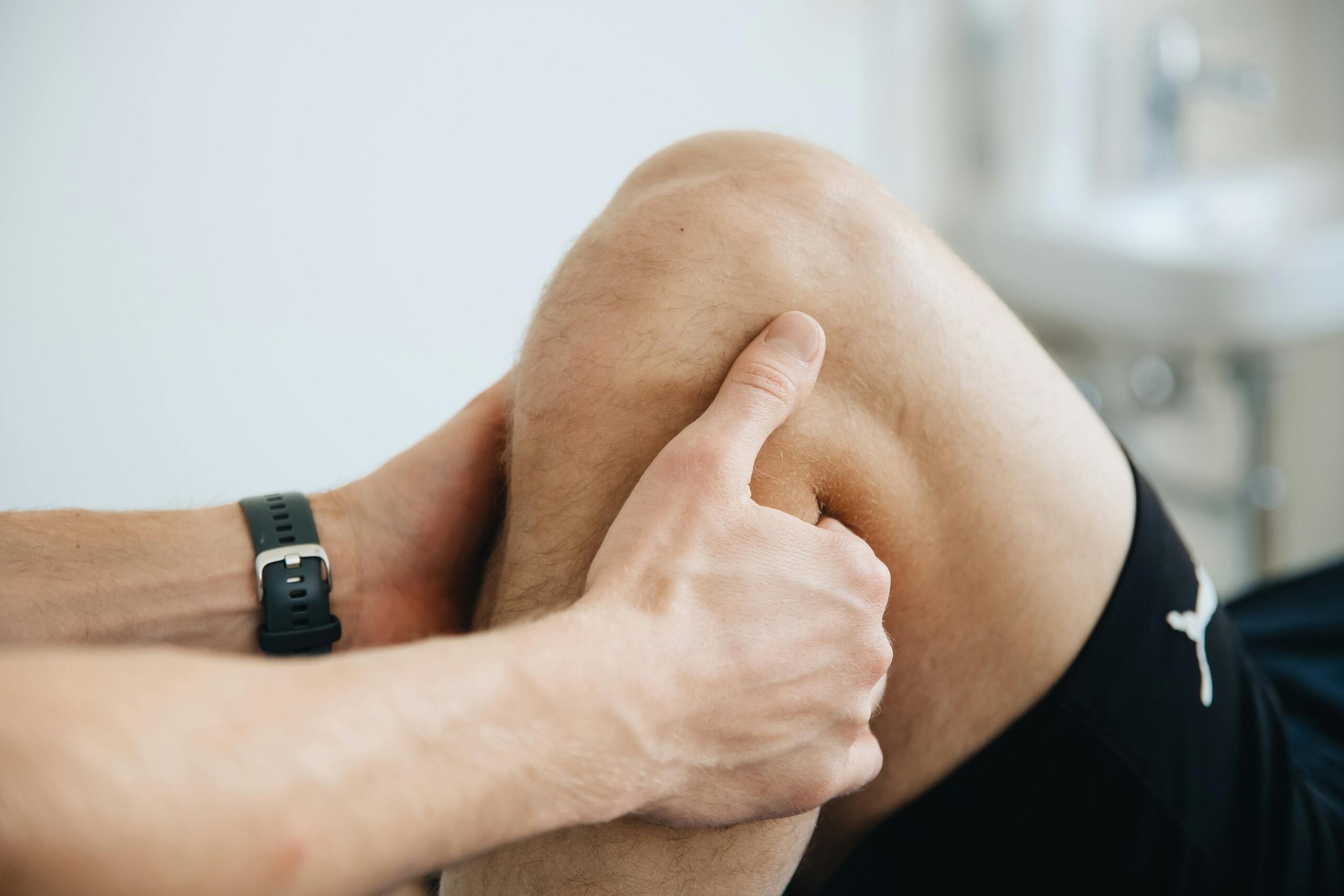 physical therapist treating knee injury