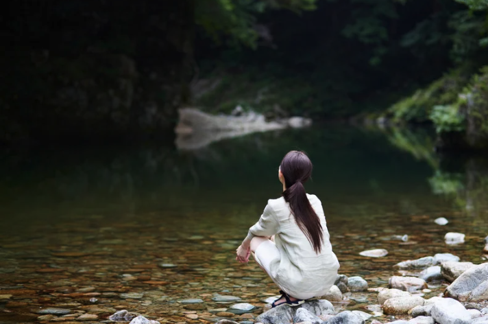 Woman with back to the camera contemplating a decsion