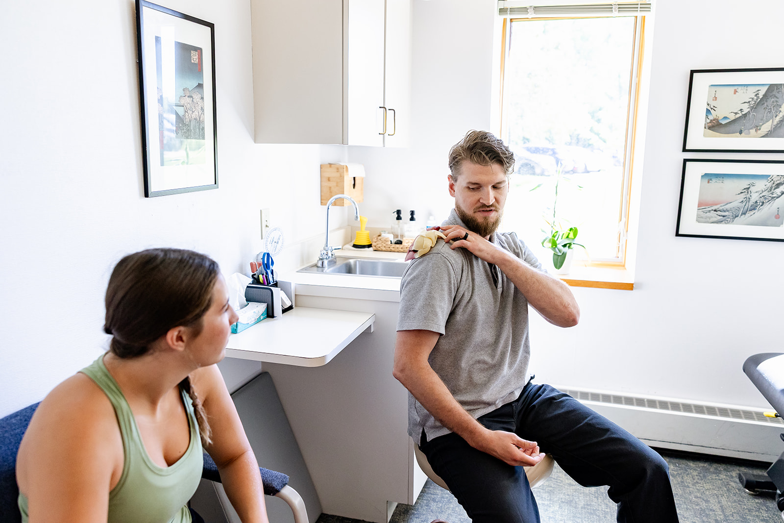 Physical therapist connecting with patient and educating them