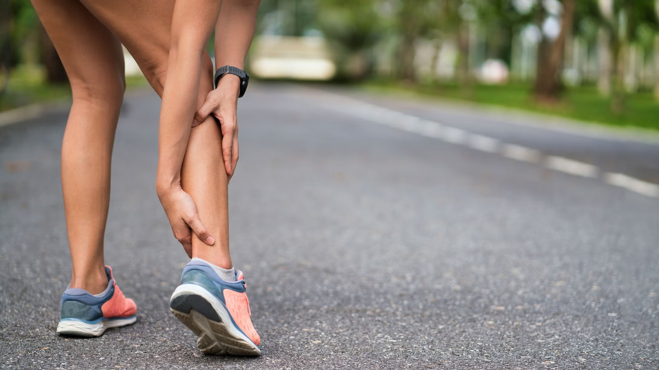 Woman suffering from Achilles Tendonitis Treated At Embody Health and Performance